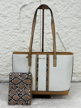 White tote bag with brown handles and trim, and a snake print phone case on a textured white background.